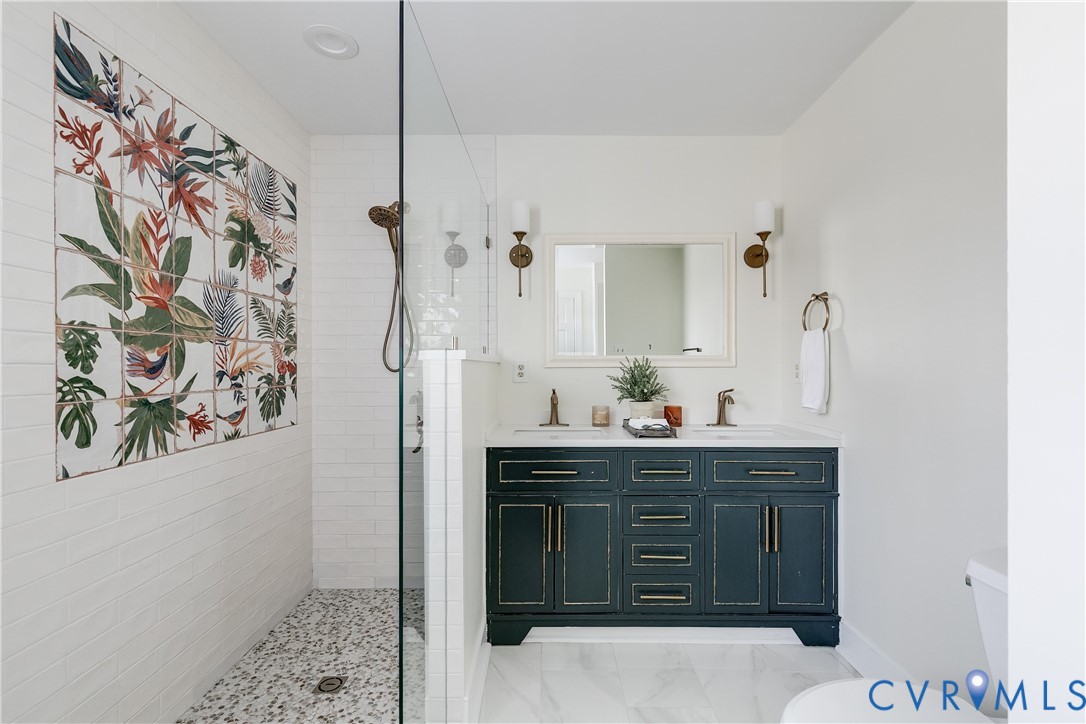 2021 Swamp Fox Road Midlothian, VA 23112 - Photo 40 of 73 a spacious bathroom with a granite countertop sink a mirror and shower