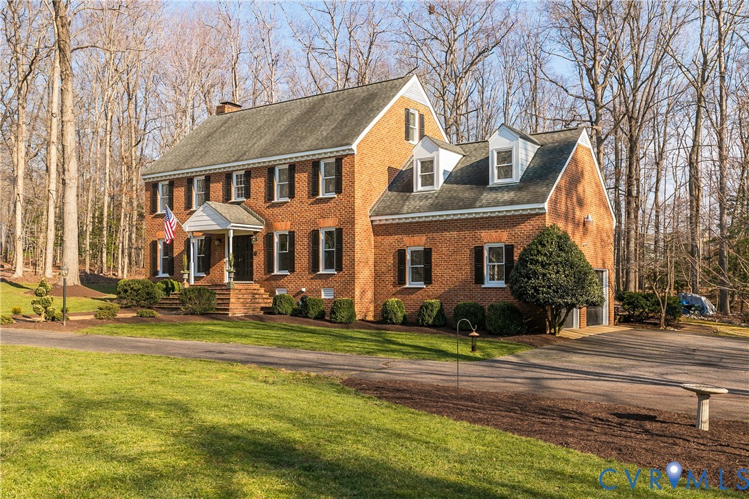 2021 Swamp Fox Road Midlothian, VA 23112 - Photo 4 of 73 a front view of a house with a yard
