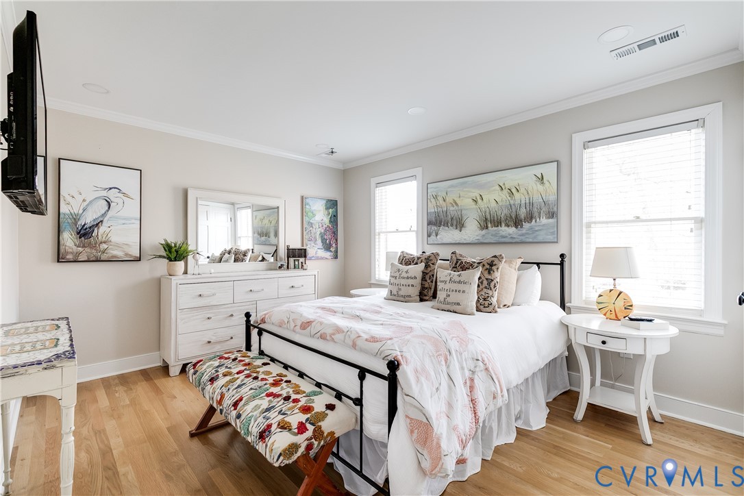 2021 Swamp Fox Road Midlothian, VA 23112 - Photo 47 of 73 a bedroom with a bed and wooden floor