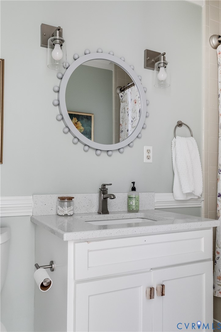 2021 Swamp Fox Road Midlothian, VA 23112 - Photo 58 of 73 a bathroom with a sink and a mirror