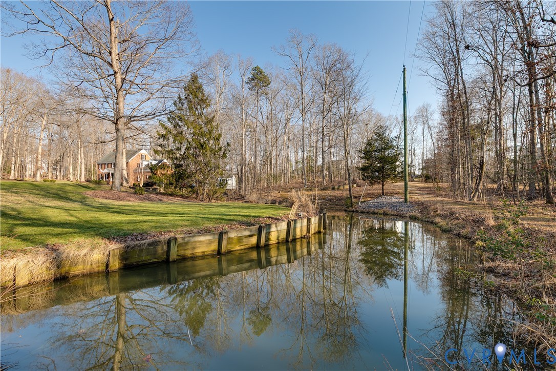2021 Swamp Fox Road Midlothian, VA 23112 - Photo 6 of 73 a view of swimming pool with outdoor seating and trees in the background