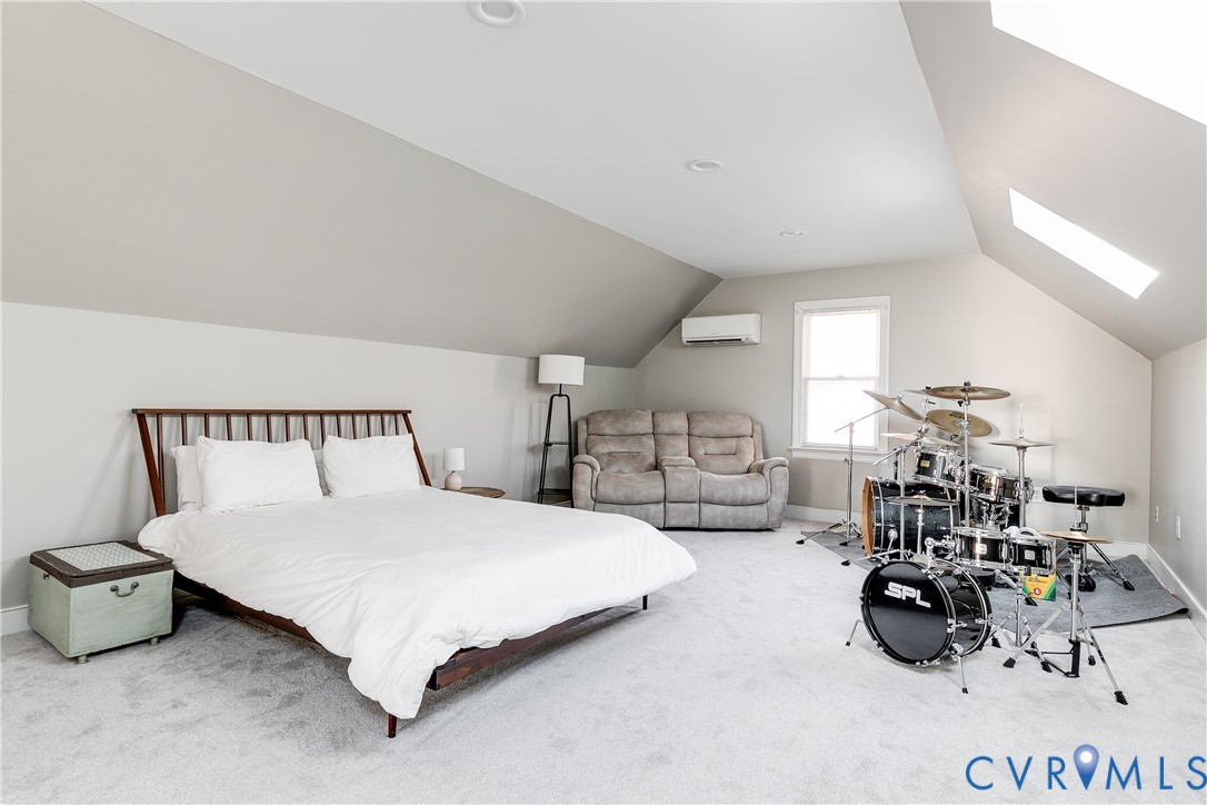 2021 Swamp Fox Road Midlothian, VA 23112 - Photo 62 of 73 a bedroom with bed and a view of living room