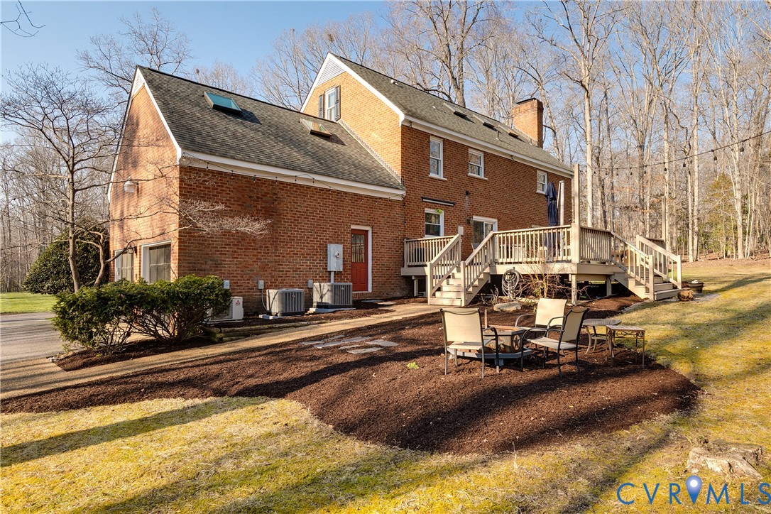 2021 Swamp Fox Road Midlothian, VA 23112 - Photo 65 of 73 a view of a building with a yard