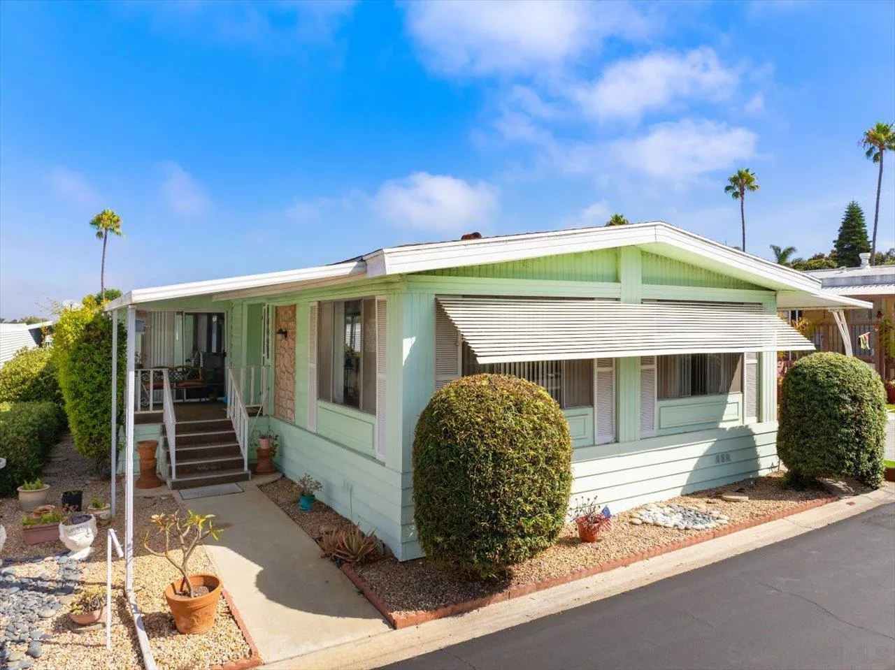 7144 Santa Rosa, Unit 86 Carlsbad, CA 92011 - Photo 1 of 30 a front view of a house