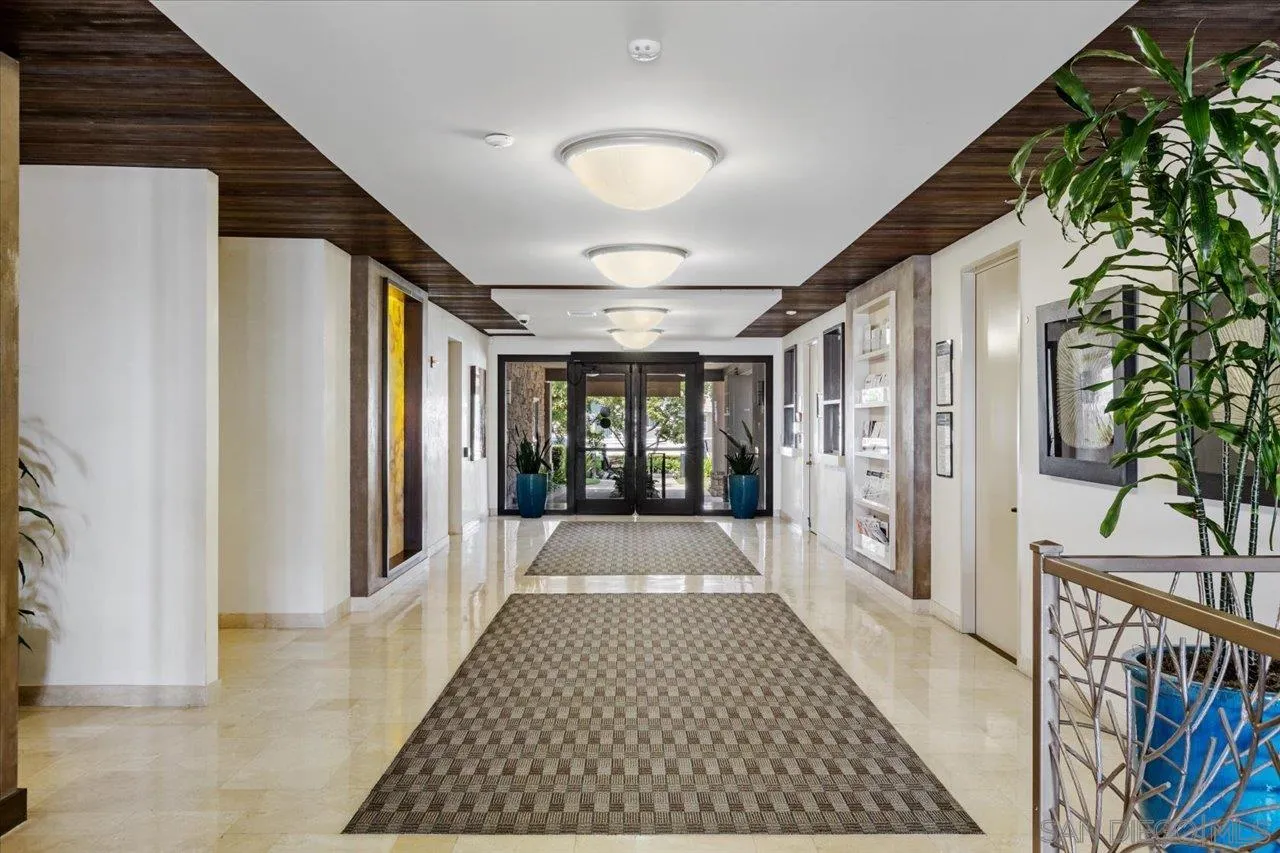 7144 Santa Rosa, Unit 86 Carlsbad, CA 92011 - Photo 14 of 30 a view of gallery with wooden floor and windows