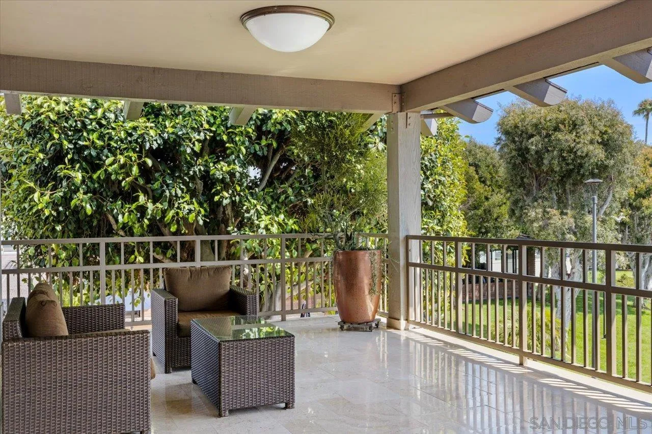 7144 Santa Rosa, Unit 86 Carlsbad, CA 92011 - Photo 15 of 30 a view of roof deck with couches and wooden fence
