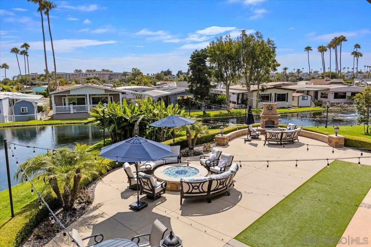 7144 Santa Rosa, Unit 86 Carlsbad, CA 92011 - Photo 21 of 30 a view of a chairs and table in patio