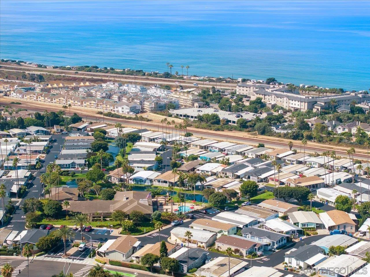 7144 Santa Rosa, Unit 86 Carlsbad, CA 92011 - Photo 29 of 30 an aerial view of a city with lots of residential buildings and ocean view in back