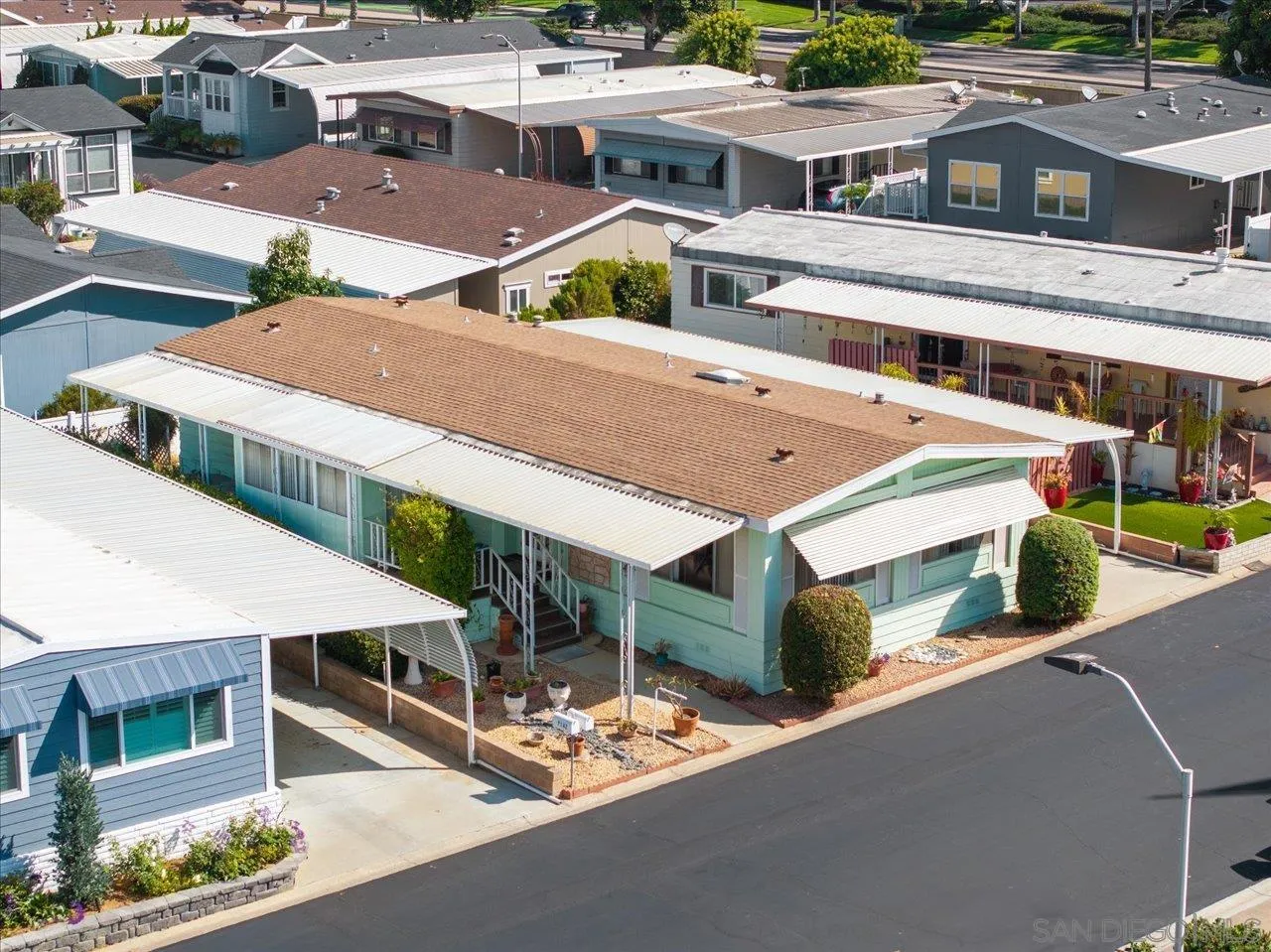 7144 Santa Rosa, Unit 86 Carlsbad, CA 92011 - Photo 3 of 30 an aerial view of a house with large windows