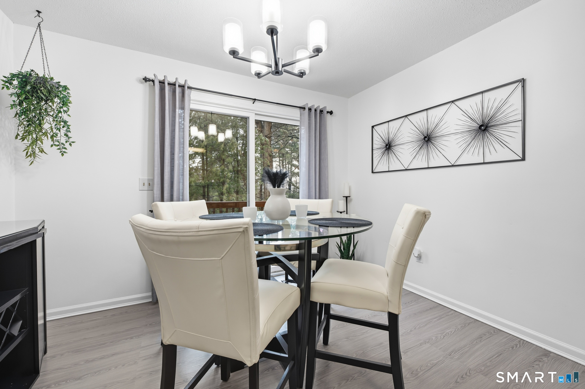 a view of a dining room with furniture window and outside view
