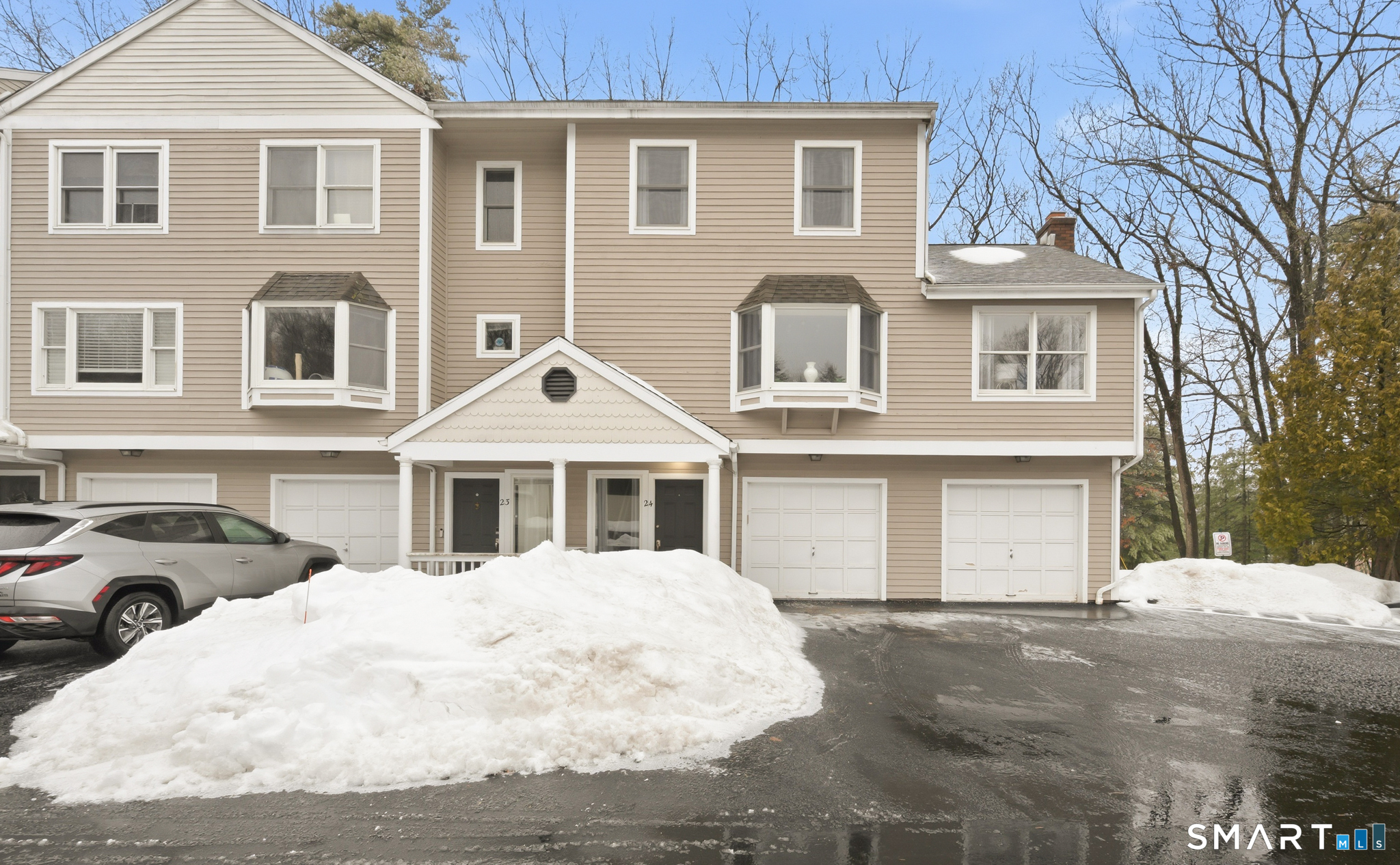 536 Redstone Hill Road, Unit 24 Bristol, CT 06010 - Photo 17 of 27 a front view of a house with a yard