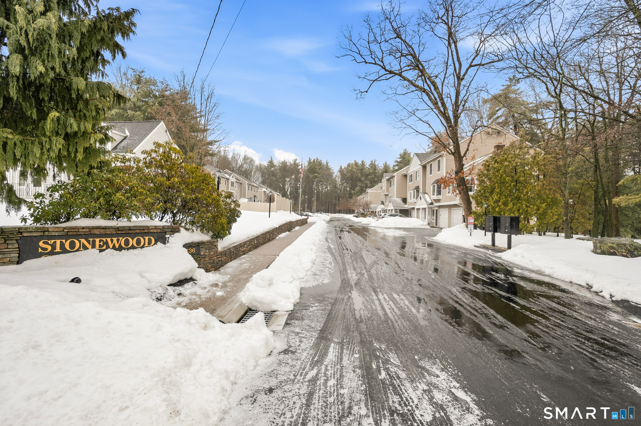 536 Redstone Hill Road, Unit 24 Bristol, CT 06010 - Photo 20 of 27 a view of snow on the road