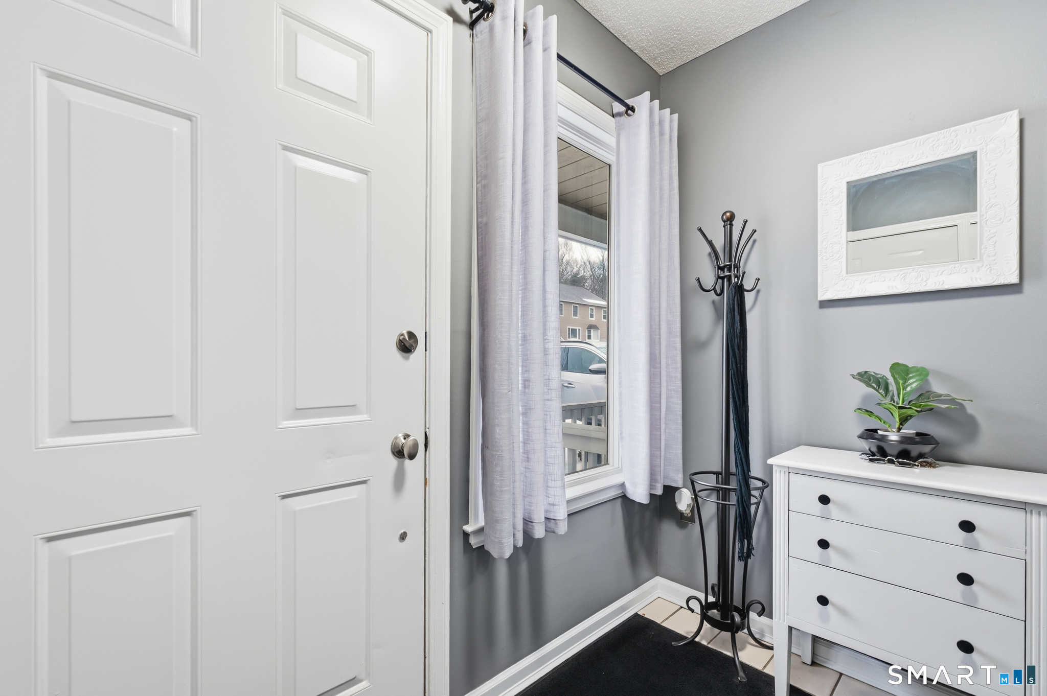 536 Redstone Hill Road, Unit 24 Bristol, CT 06010 - Photo 21 of 27 a view of a hallway with closet and mirror