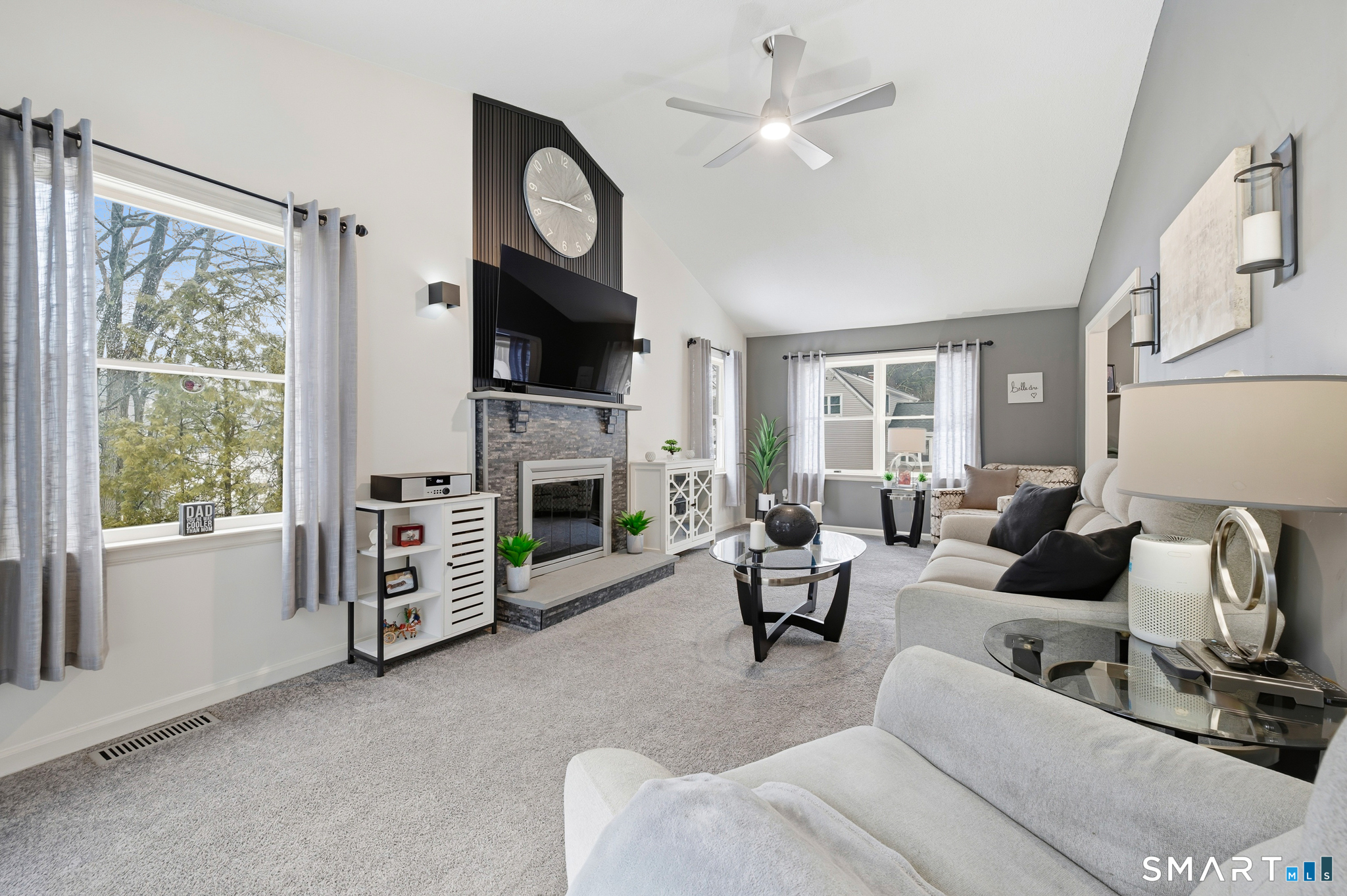 536 Redstone Hill Road, Unit 24 Bristol, CT 06010 - Photo 5 of 27 a living room with furniture a fireplace and a flat screen tv