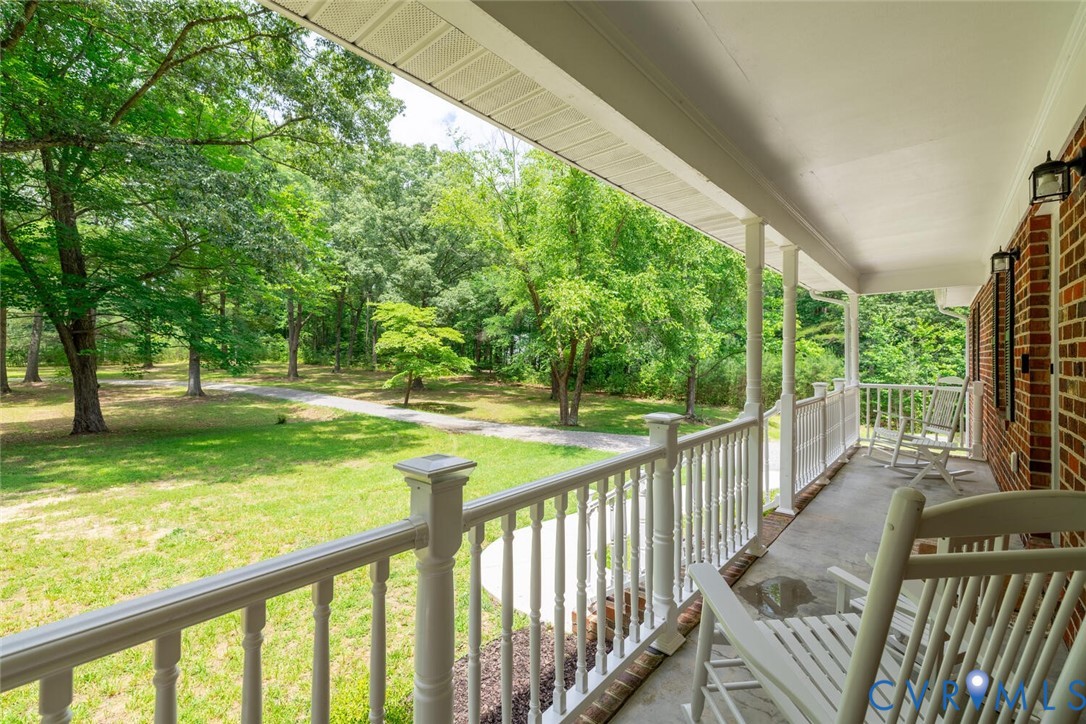 12397 New Market Mill Road Beaverdam, VA 23015 - Photo 43 of 44 a view of a porch with wooden floor and fence