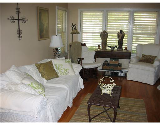 4005 Lowman Street Corpus Christi, TX 78411 - Photo 2 of 10 a bedroom with a bed and a couch