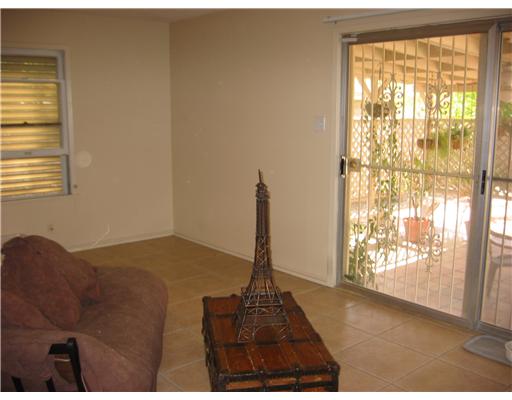 4005 Lowman Street Corpus Christi, TX 78411 - Photo 4 of 10 a living room with furniture and a window