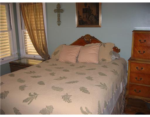 4005 Lowman Street Corpus Christi, TX 78411 - Photo 5 of 10 a bedroom with a bed and a window