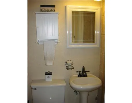 a bathroom with a sink a mirror and a window