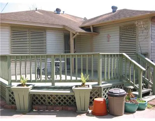 a view of a patio with table and chairs