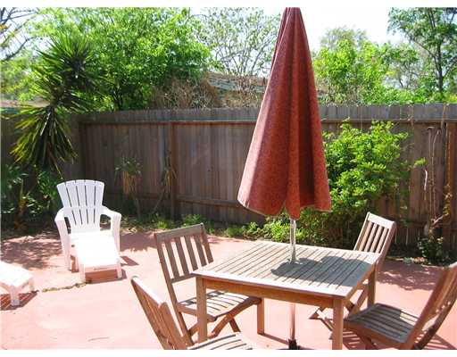 4005 Lowman Street Corpus Christi, TX 78411 - Photo 10 of 10 a view of a wooden bench with a chair in the patio