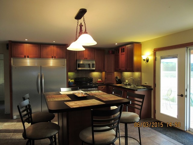 539 Morgan Road Amboy, IL 61310 - Photo 3 of 12 a kitchen with a table chairs refrigerator and cabinets