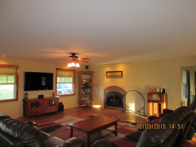 539 Morgan Road Amboy, IL 61310 - Photo 4 of 12 a living room with furniture a flat screen tv and a fireplace
