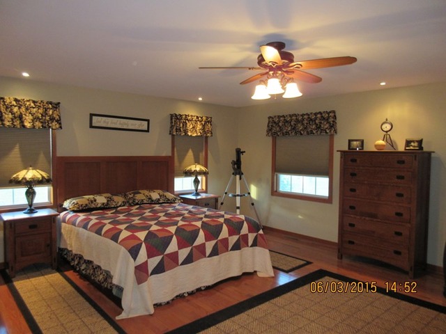 539 Morgan Road Amboy, IL 61310 - Photo 5 of 12 a bedroom with a bed and a dresser