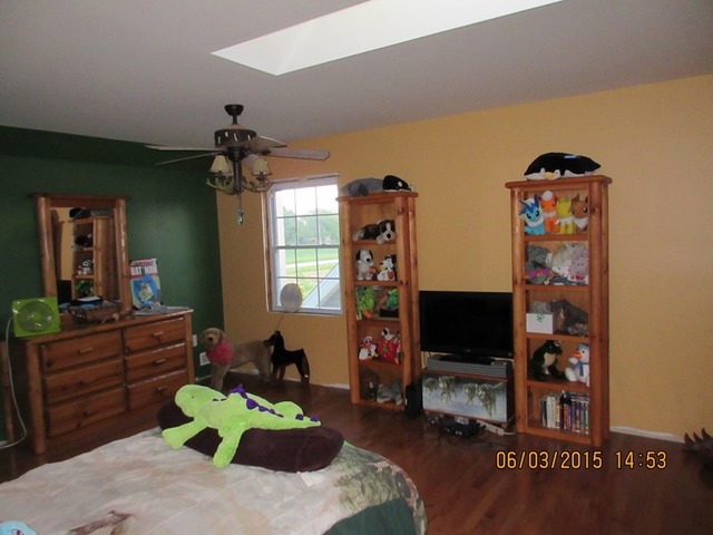 539 Morgan Road Amboy, IL 61310 - Photo 7 of 12 a living room with furniture a flat screen tv and a window
