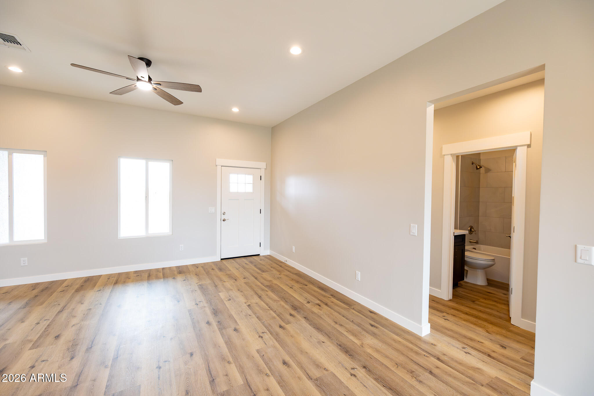 11459 East Adamsville Road Florence, AZ 85132 - Photo 17 of 63 wooden floor in an empty room with a window