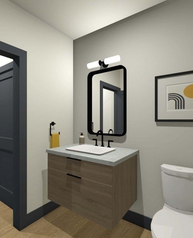 37 Vantage Point Drive, Unit 2 Laconia, NH 03246 - Photo 7 of 16 a bathroom with a toilet sink and mirror
