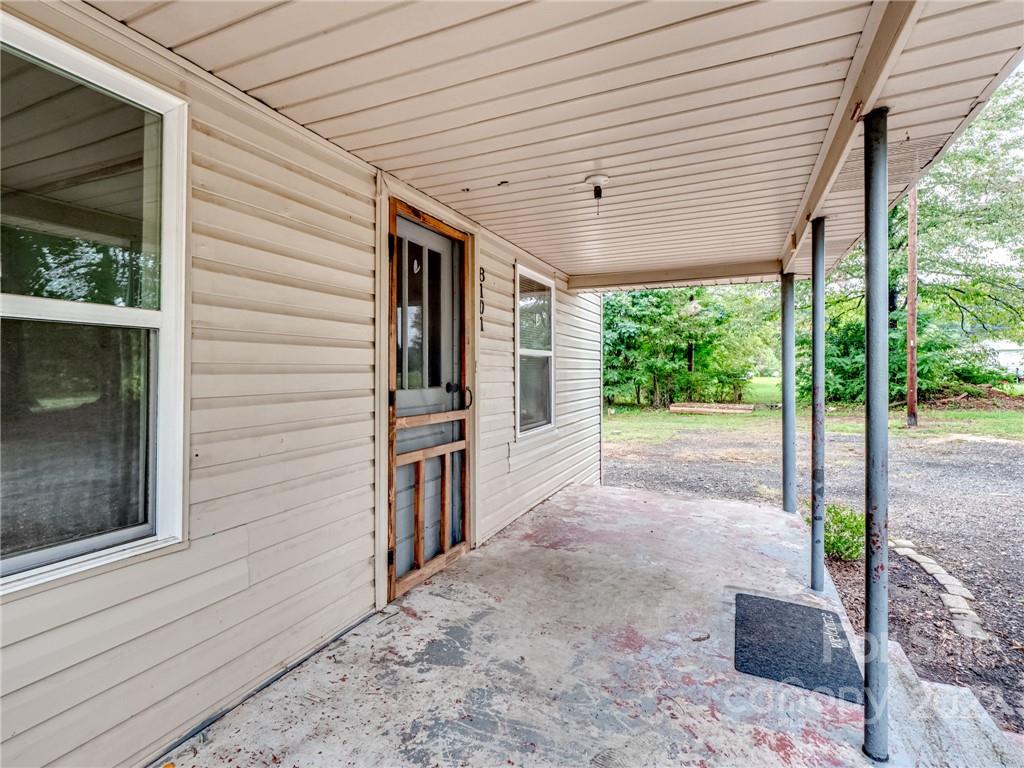 8101 Freeze Road Kannapolis, NC 28081 - Photo 4 of 23 a view of a porch with furniture and garden