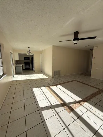 a big room with closet and windows