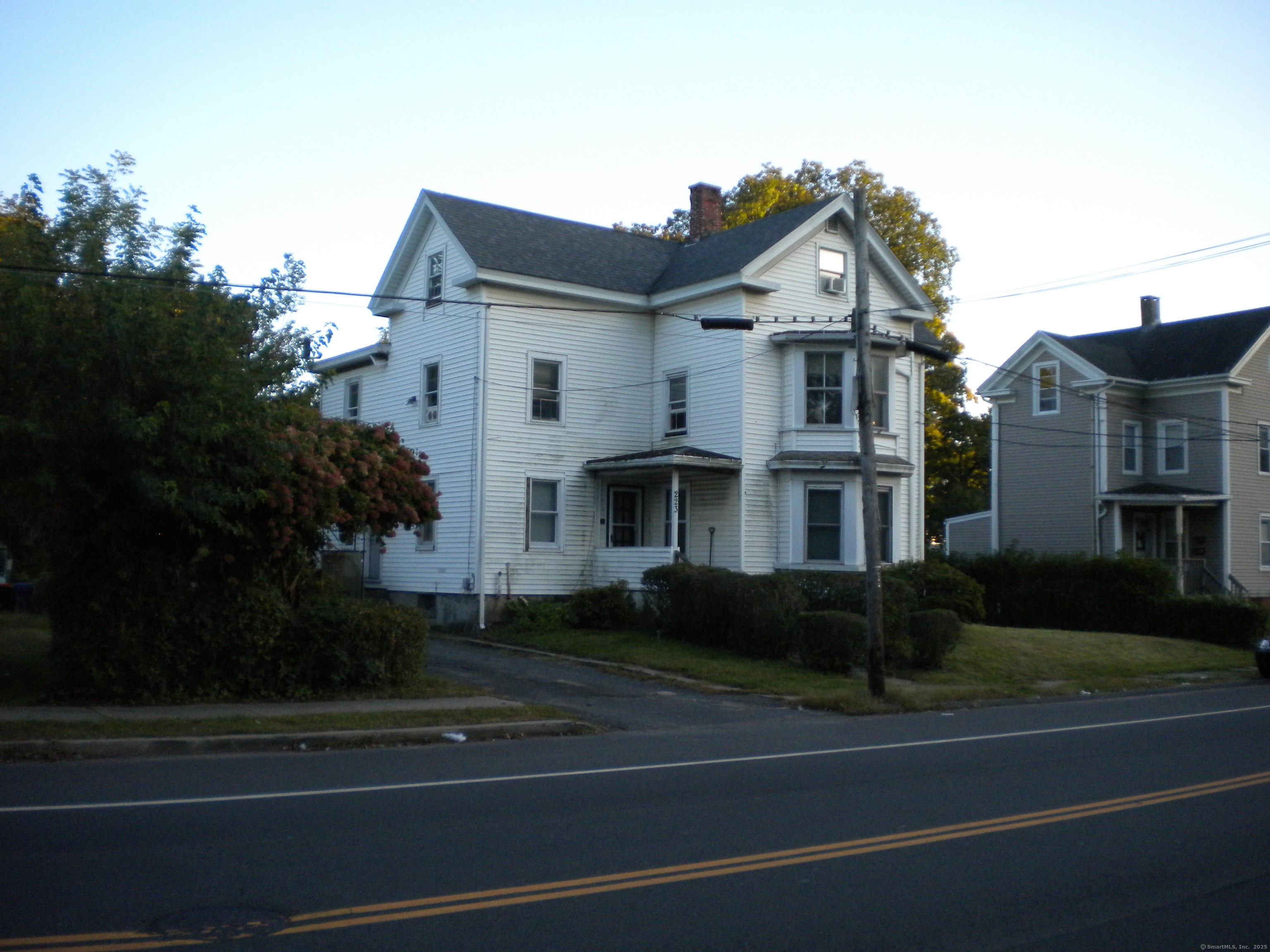 223 Broad Street Meriden, CT 06450 - Photo 16 of 17 a front view of a house with a yard
