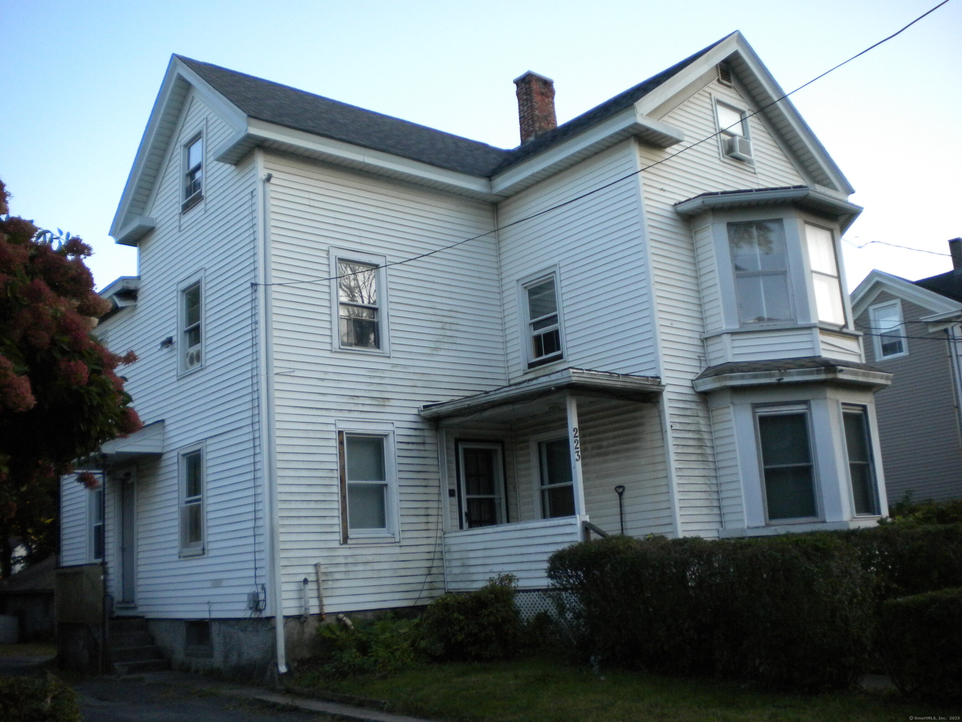 223 Broad Street Meriden, CT 06450 - Photo 17 of 17 a front view of a house with a yard