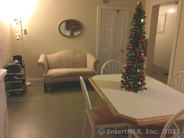 223 Broad Street Meriden, CT 06450 - Photo 10 of 17 a picture of a couch in a bathroom