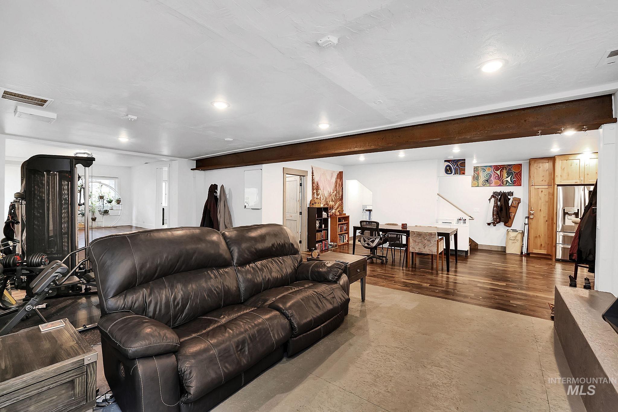 715 Spruce Street McCall, ID 83638 - Photo 12 of 37 Living room with concrete flooring, recessed lighting, and beamed ceiling