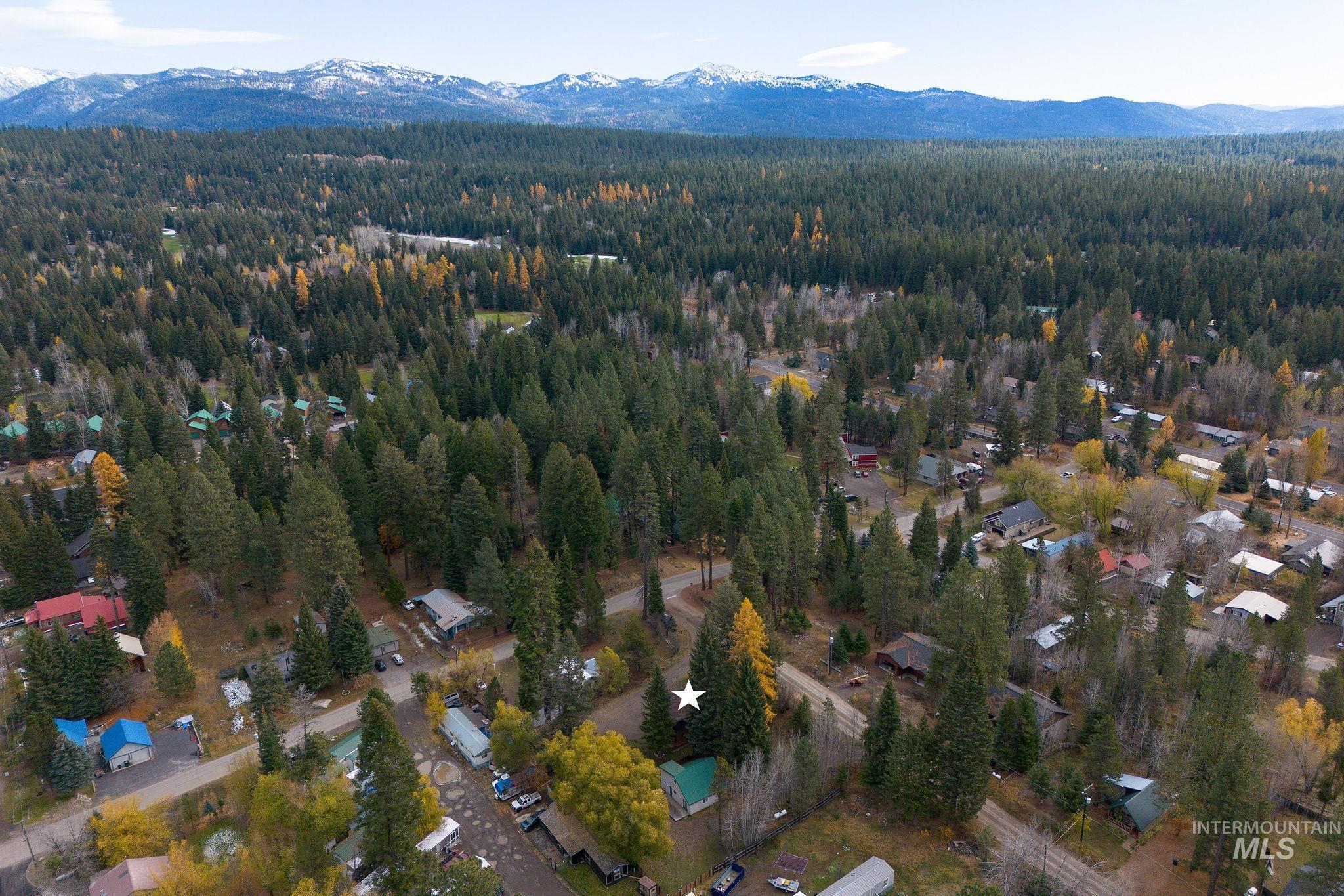 715 Spruce Street McCall, ID 83638 - Photo 33 of 37 Aerial view of property and surrounding area with a mountain backdrop