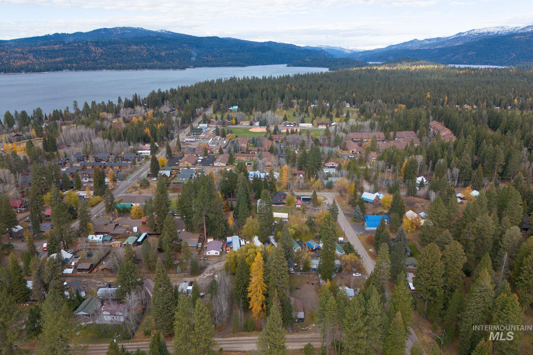 715 Spruce Street McCall, ID 83638 - Photo 35 of 37 Aerial view of property and surrounding area featuring a heavily wooded area and a water and mountain view