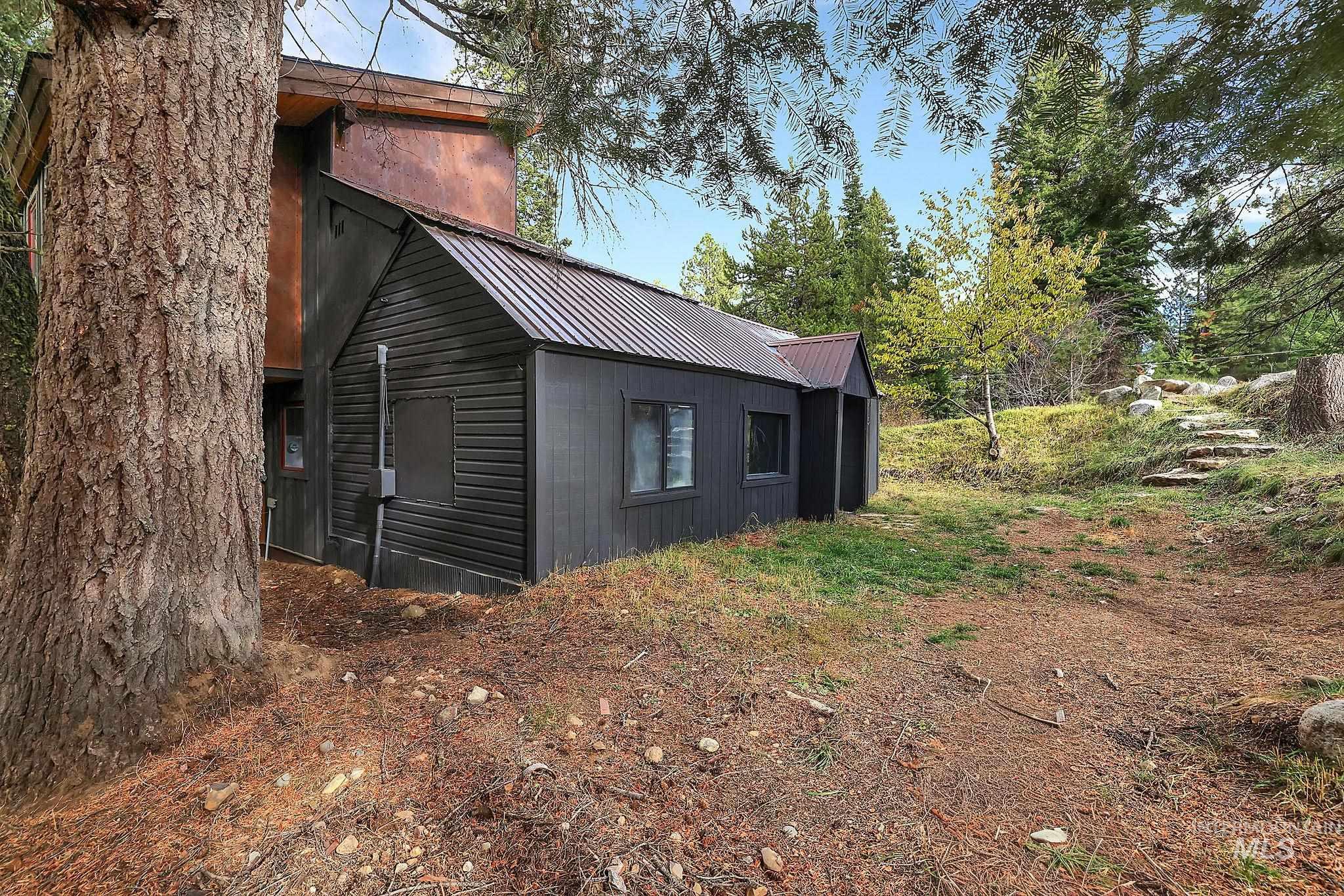 715 Spruce Street McCall, ID 83638 - Photo 8 of 37 View of side of property featuring a metal roof