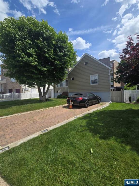 47 Worth Street Hackensack, NJ 07601 - Photo 2 of 2 a view of a backyard with a garden