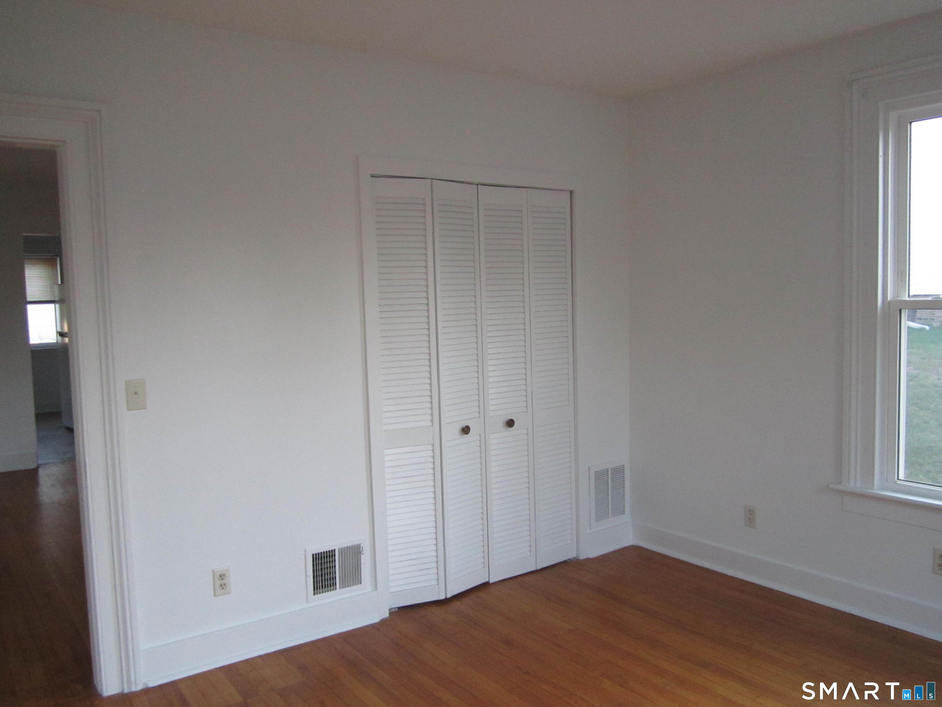 78 Alcove Street Meriden, CT 06451 - Photo 7 of 10 a view of a small space with wooden floor and a window