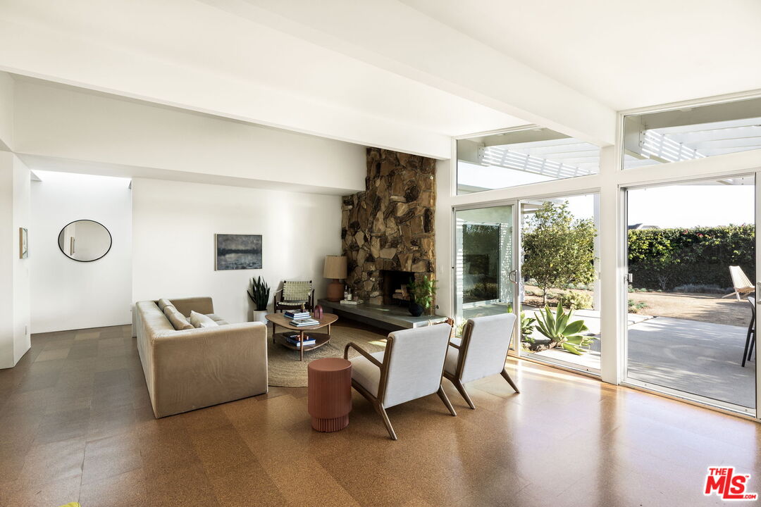 3702 Oceanhill Way Malibu, CA 90265 - Photo 2 of 8 a living room with furniture and a large window