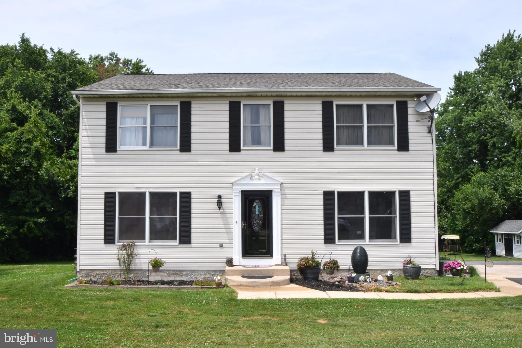 8126 Old Philadelphia Road Baltimore, MD 21237 - Photo 1 of 30 a front view of a house with a yard