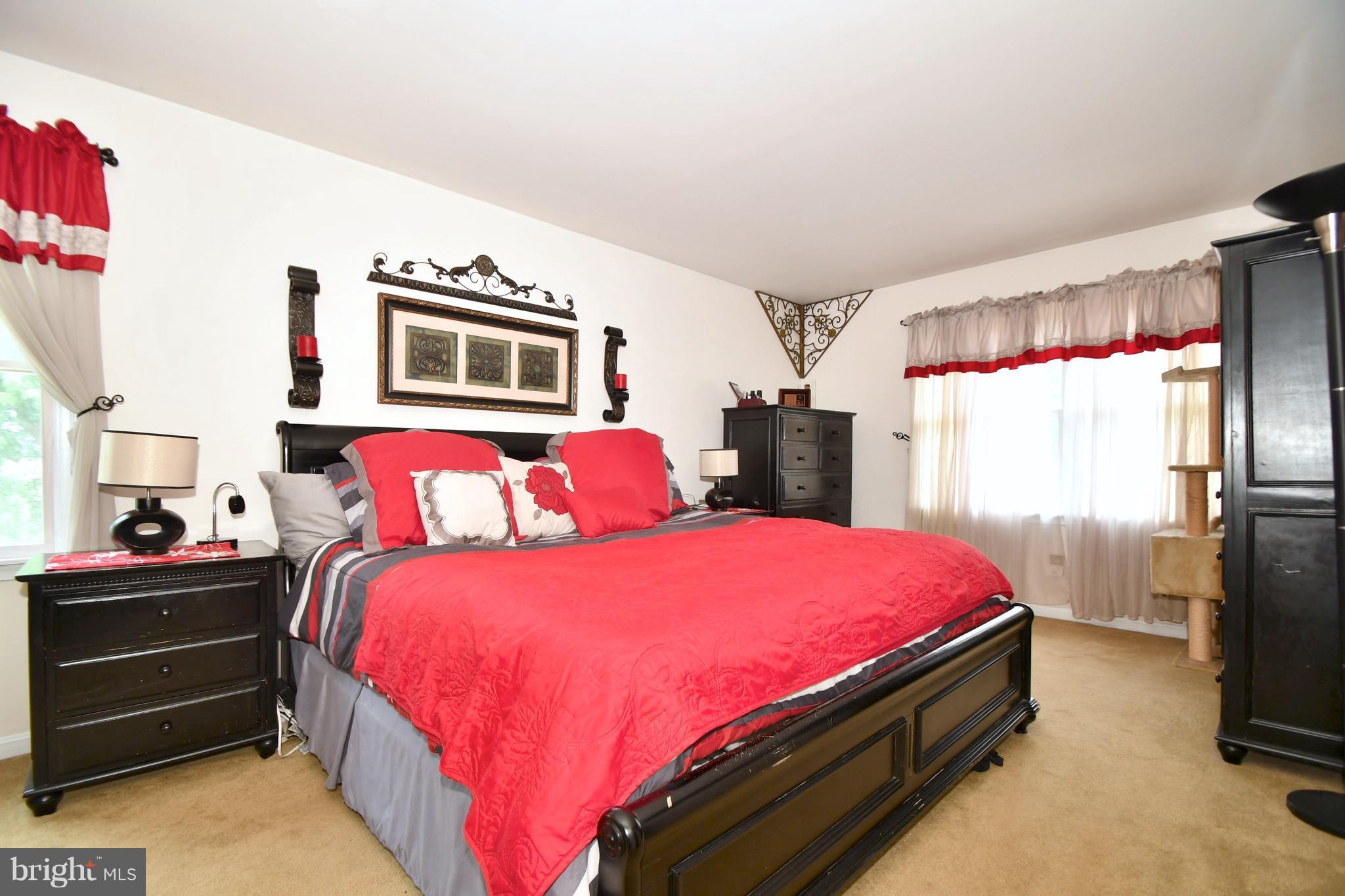 8126 Old Philadelphia Road Baltimore, MD 21237 - Photo 13 of 30 a bedroom with bed and a window