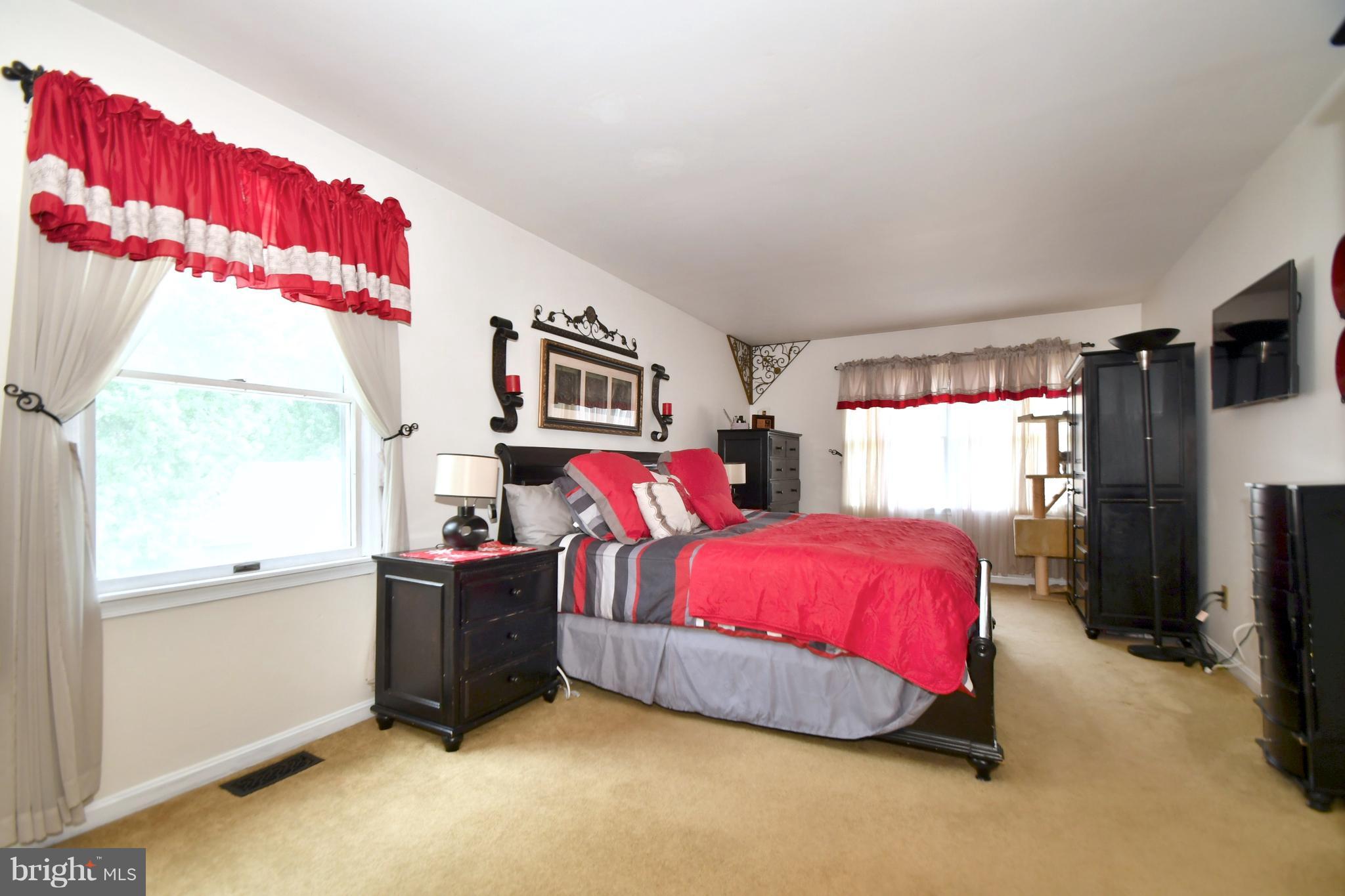 8126 Old Philadelphia Road Baltimore, MD 21237 - Photo 14 of 30 a bedroom with a bed and window