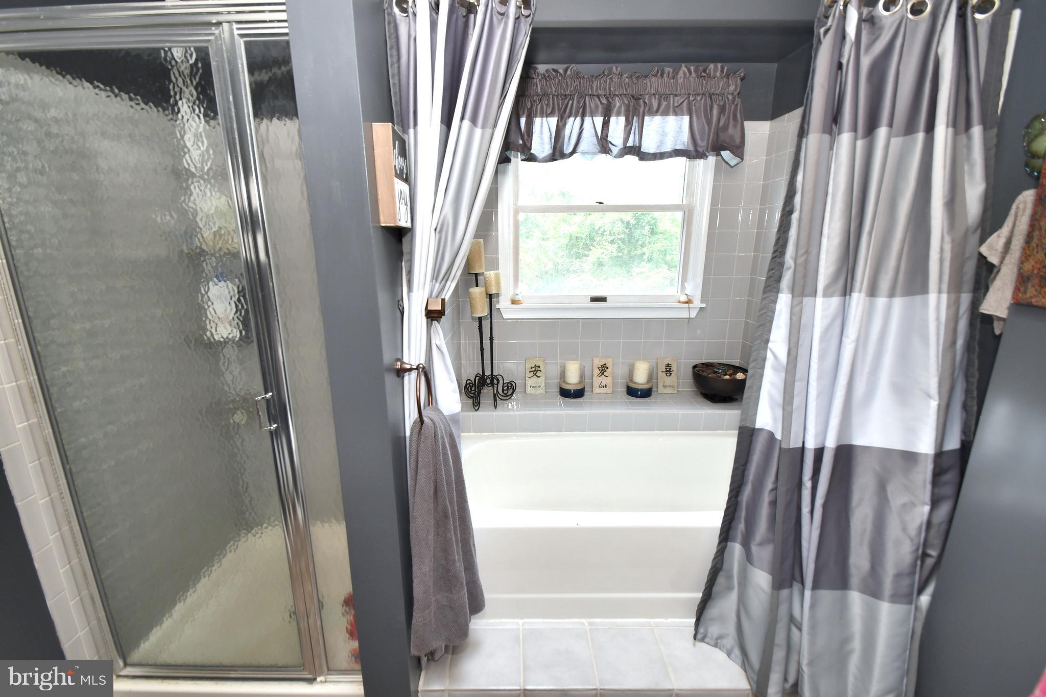 8126 Old Philadelphia Road Baltimore, MD 21237 - Photo 16 of 30 a bathroom with a tub and a sink