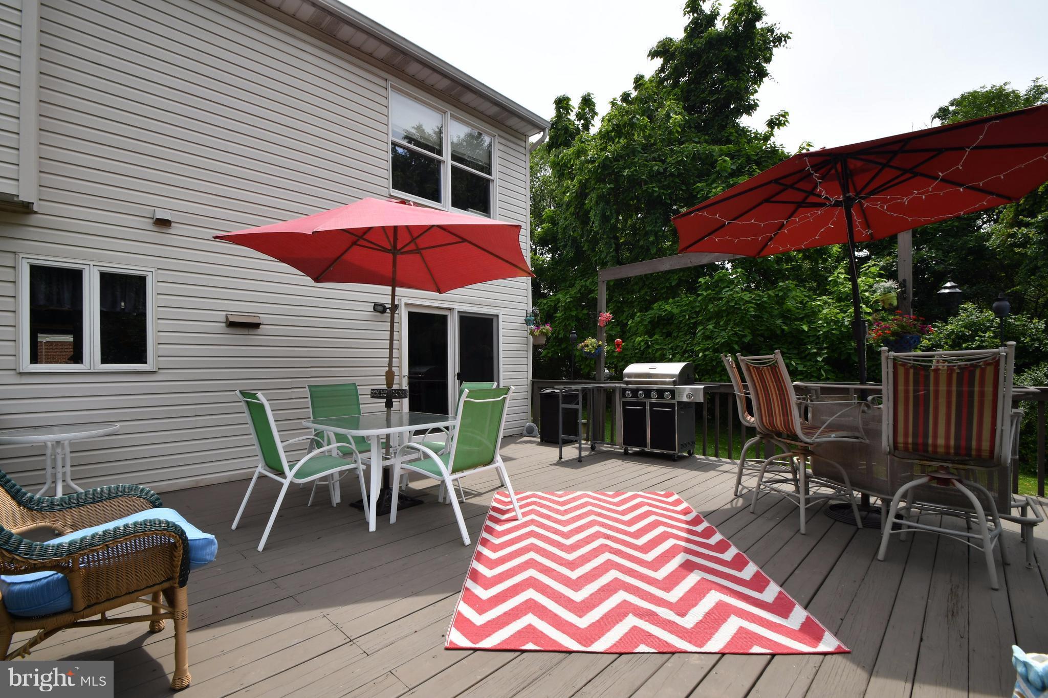 8126 Old Philadelphia Road Baltimore, MD 21237 - Photo 28 of 30 a patio with a table and chairs