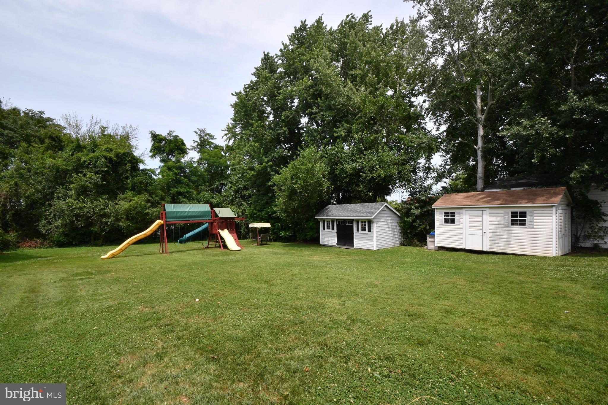 8126 Old Philadelphia Road Baltimore, MD 21237 - Photo 29 of 30 a view of a house with a yard and sitting area