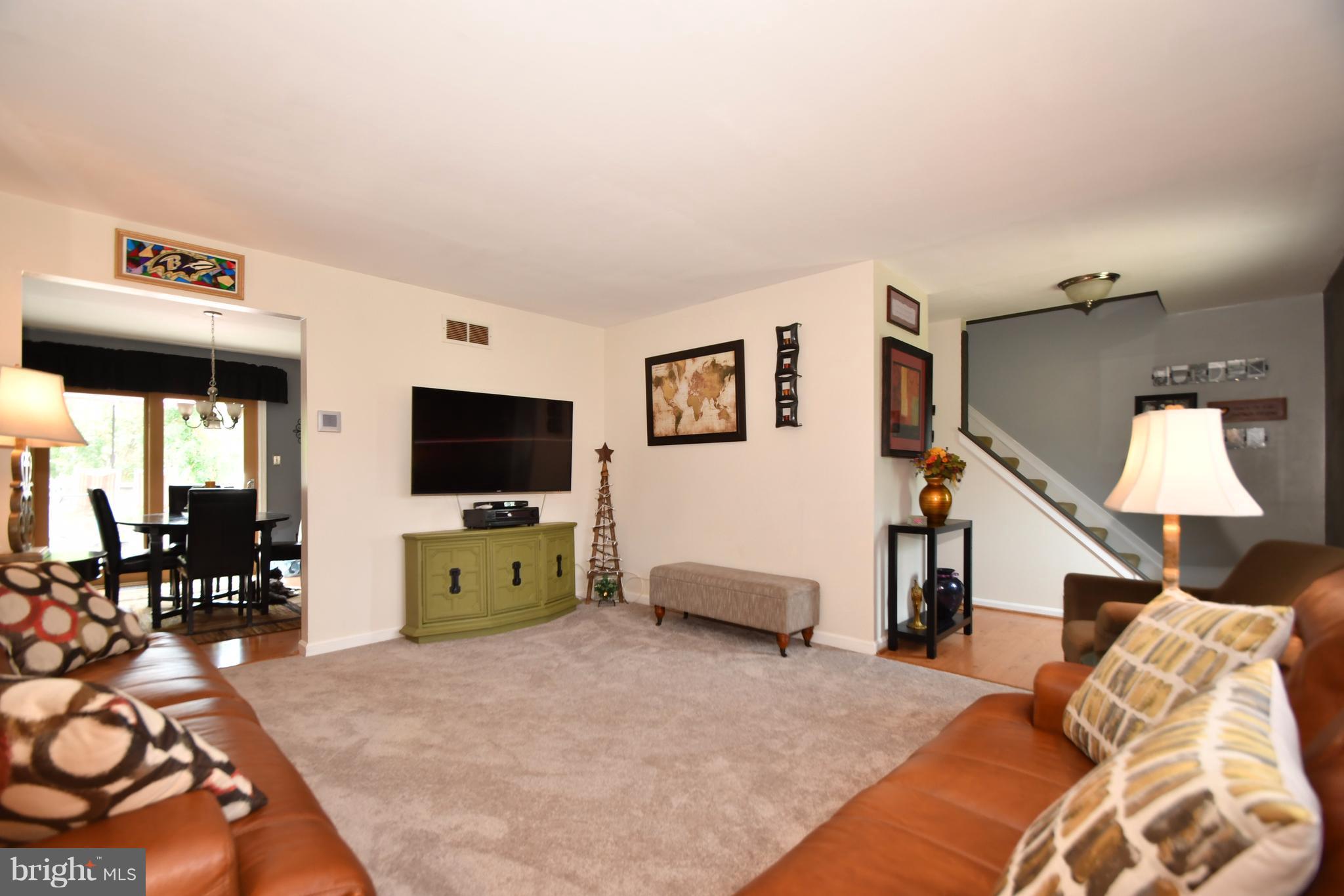 8126 Old Philadelphia Road Baltimore, MD 21237 - Photo 4 of 30 a living room with furniture and a flat screen tv